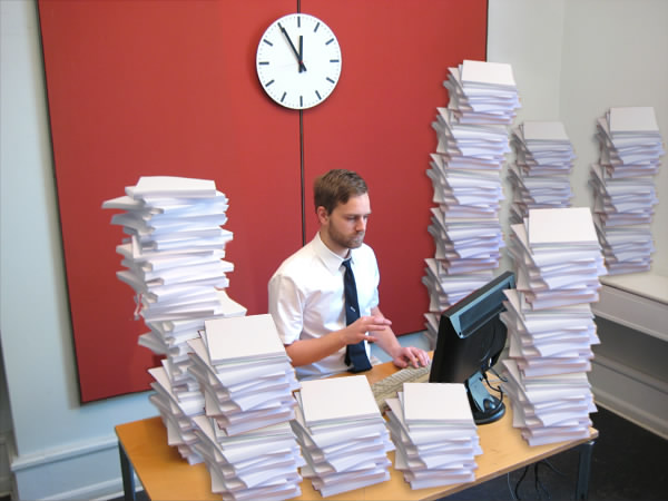 Picture of a bunch of paperwork on a desk